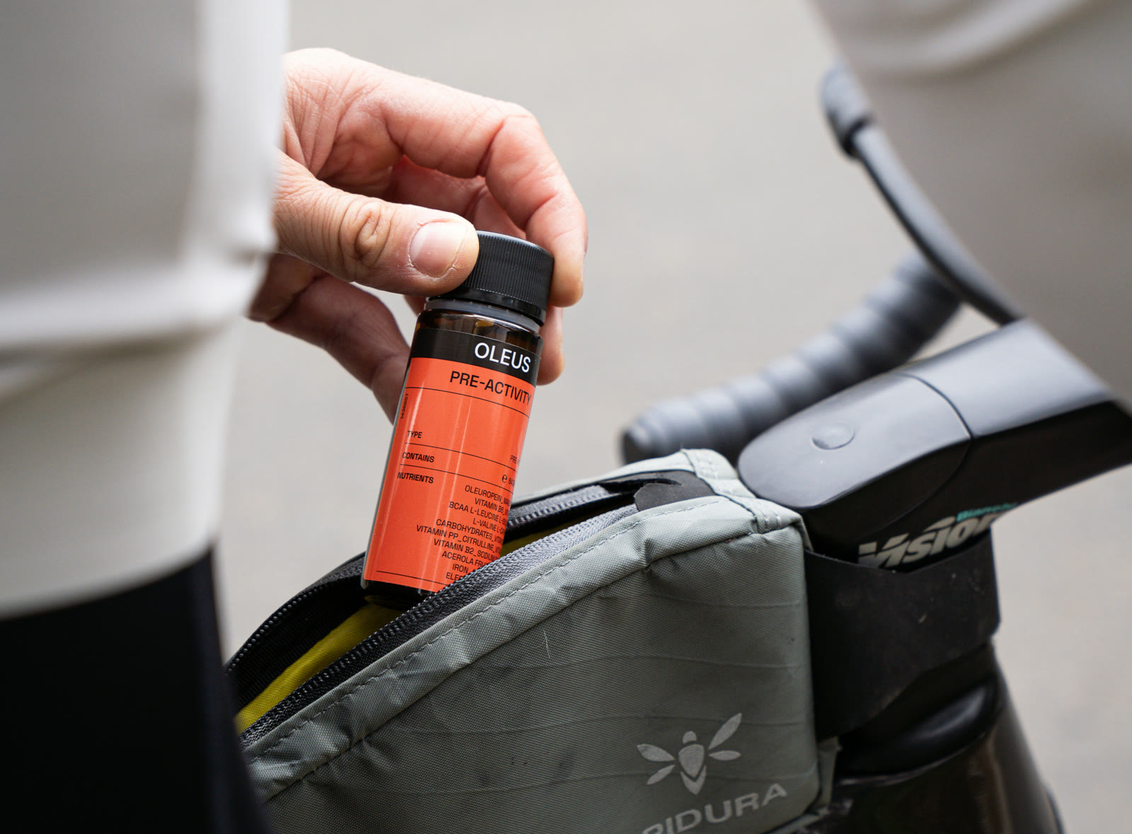 OLEUS pre-activity shot in a cyclist's frame bag